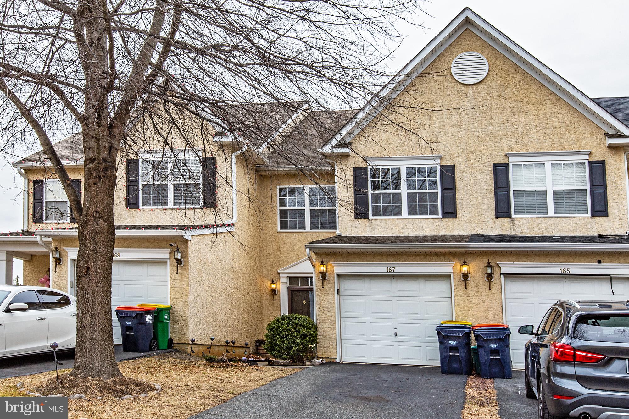 a front view of a house with parking