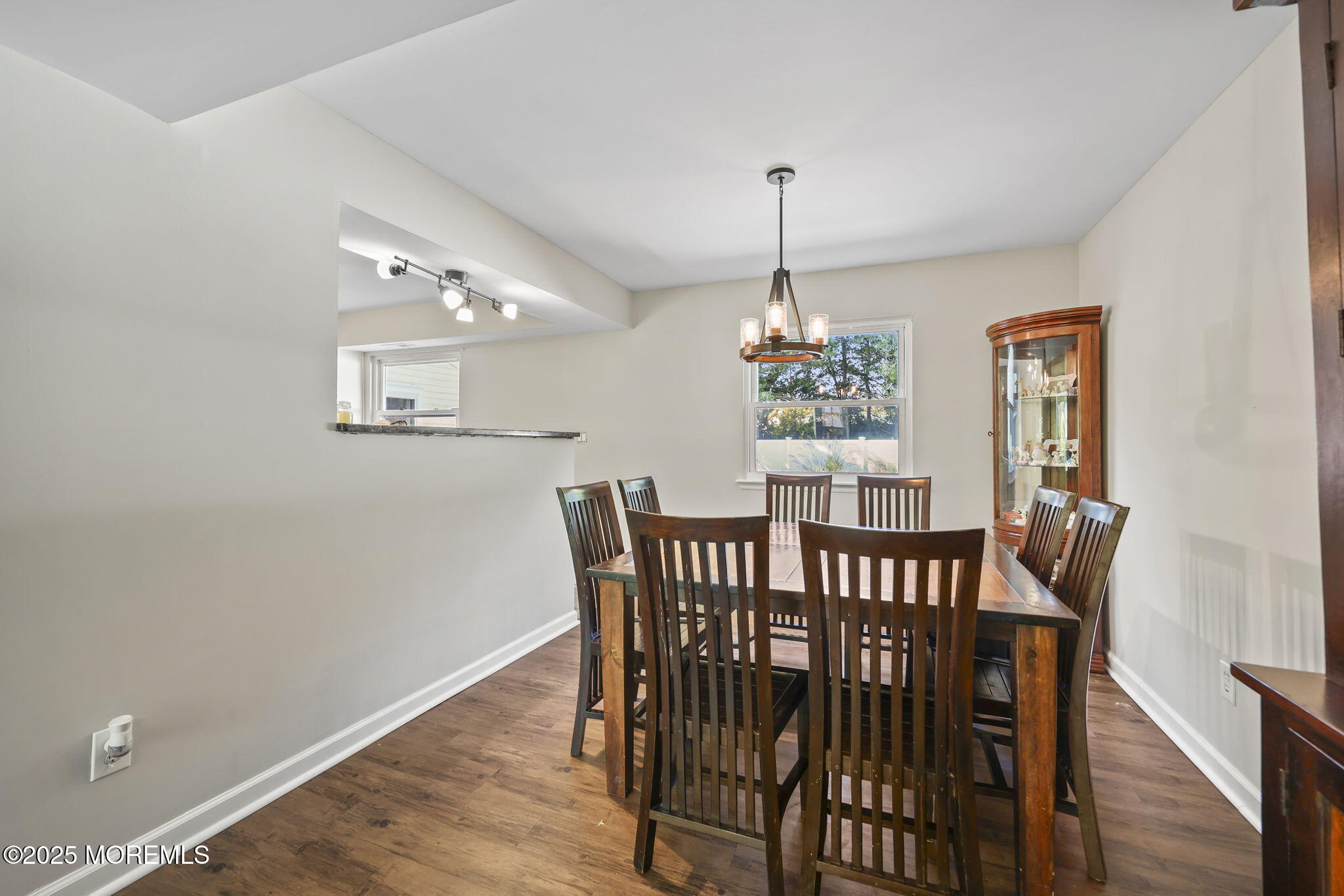99 Glenarden Drive Howell, NJ 07731 - Photo 12 of 37 a view of a dining room with furniture window and wooden floor