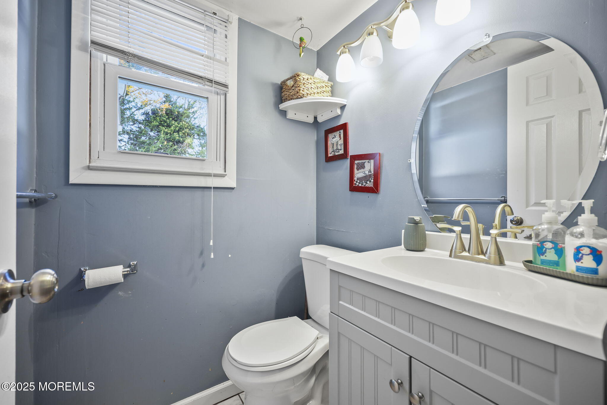 99 Glenarden Drive Howell, NJ 07731 - Photo 14 of 37 a bathroom with a toilet a sink and mirror