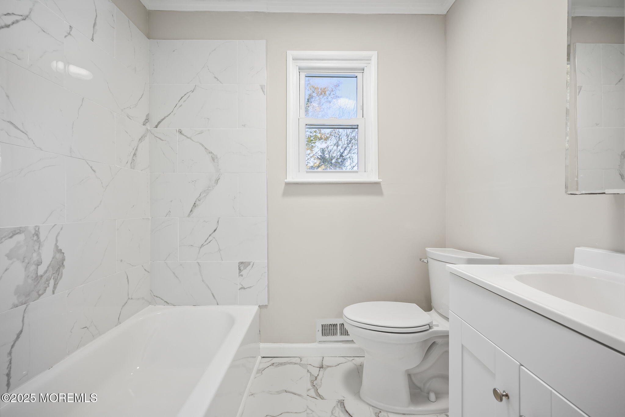 99 Glenarden Drive Howell, NJ 07731 - Photo 21 of 37 a bathroom with a toilet and a bathtub