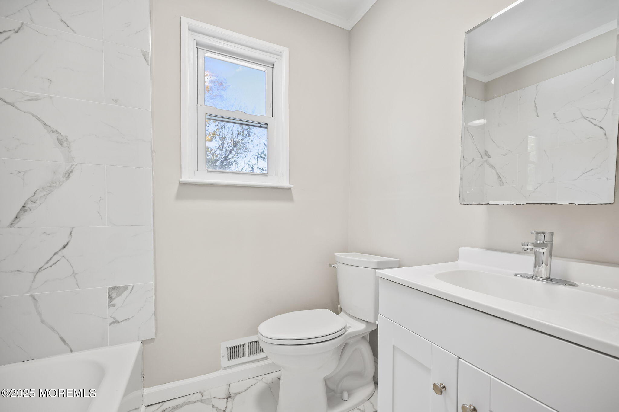 99 Glenarden Drive Howell, NJ 07731 - Photo 22 of 37 a bathroom with a toilet a sink and mirror