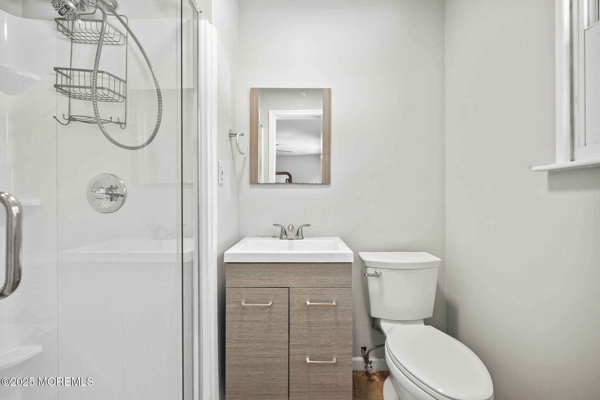 99 Glenarden Drive Howell, NJ 07731 - Photo 29 of 37 a bathroom with a toilet sink shower and mirror