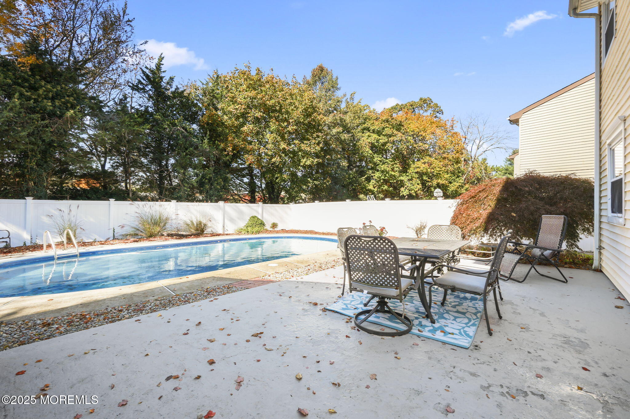 99 Glenarden Drive Howell, NJ 07731 - Photo 32 of 37 a view of a terrace with chairs and wooden fence