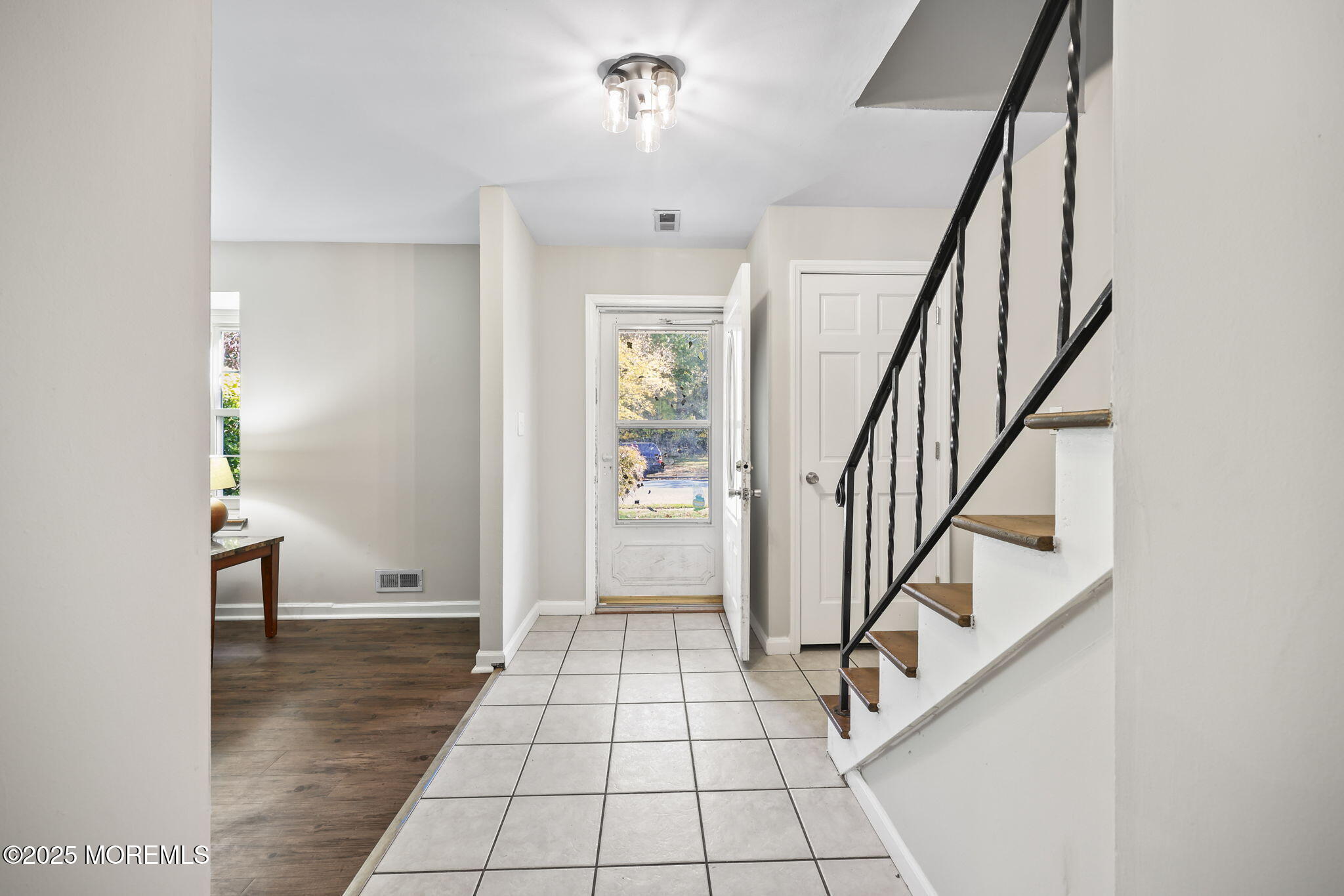 99 Glenarden Drive Howell, NJ 07731 - Photo 6 of 37 a view of an entryway with stairs