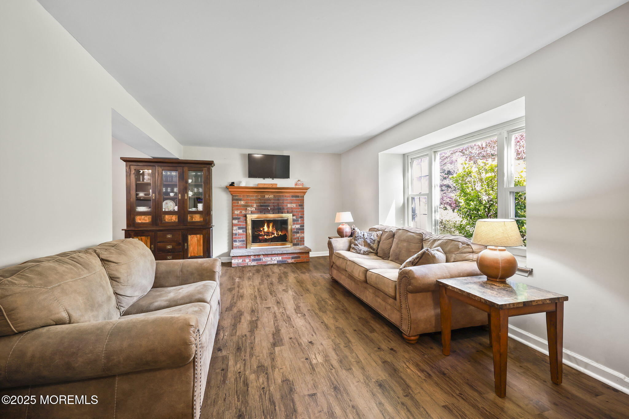 99 Glenarden Drive Howell, NJ 07731 - Photo 8 of 37 a living room with furniture and a fireplace