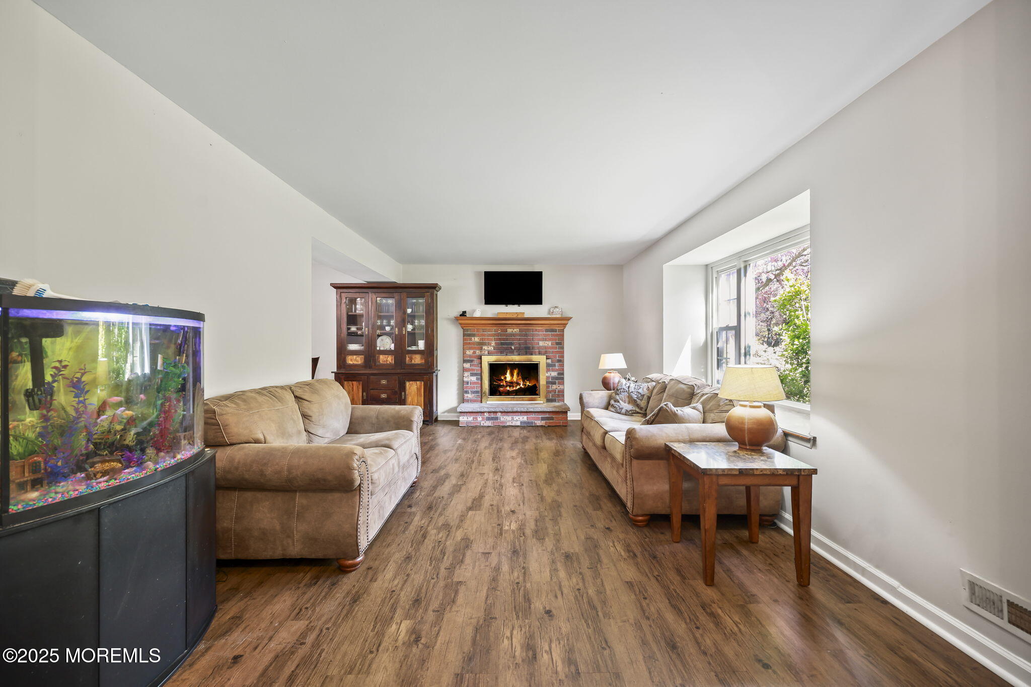 99 Glenarden Drive Howell, NJ 07731 - Photo 9 of 37 a living room with furniture and a fireplace
