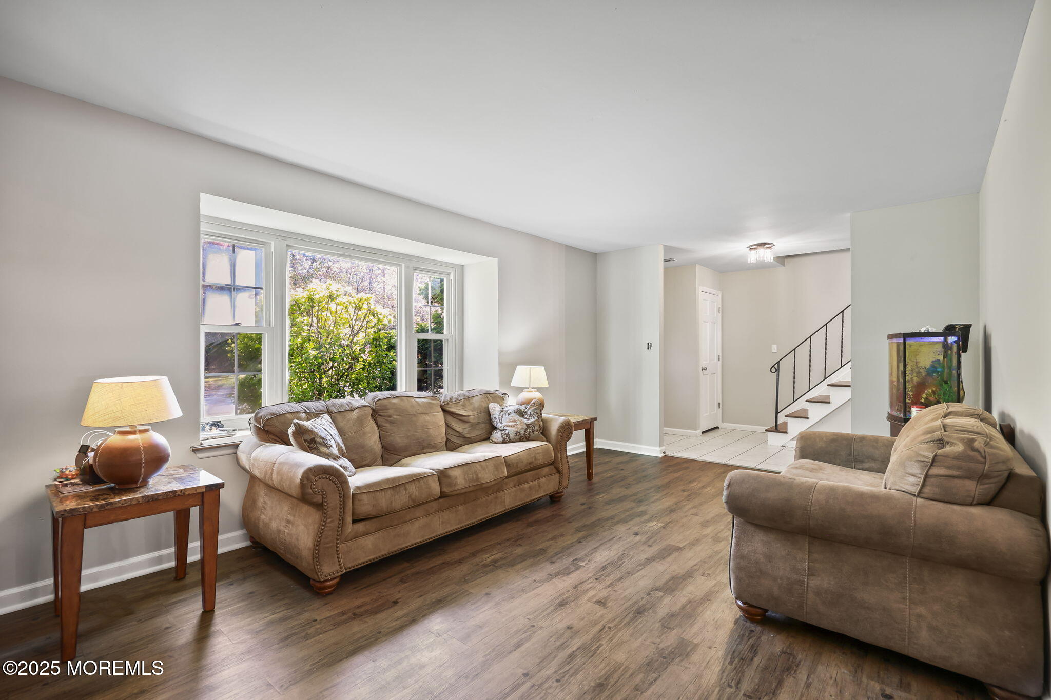 99 Glenarden Drive Howell, NJ 07731 - Photo 10 of 37 a living room with furniture and a lamp