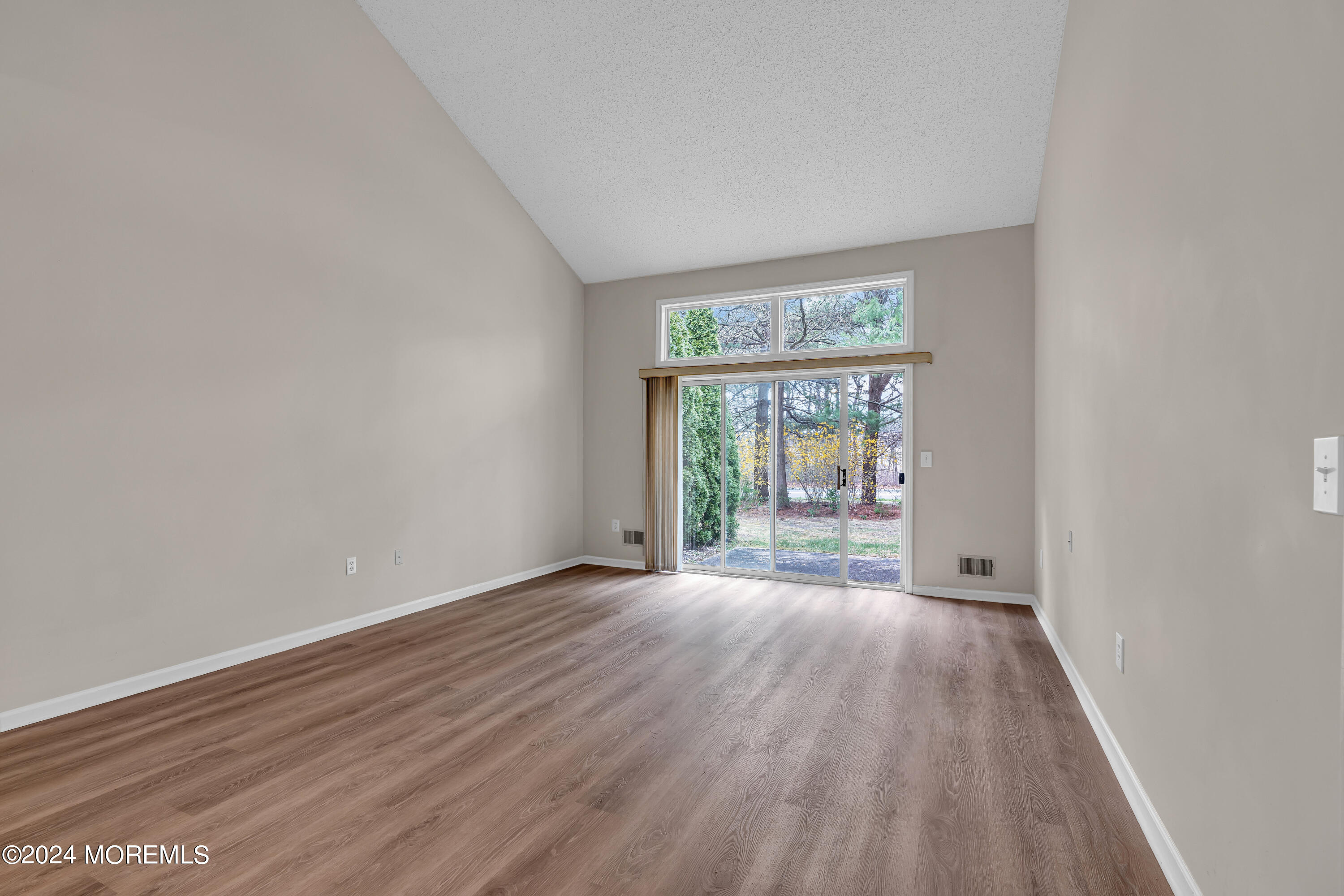 12 Riva Boulevard Brick, NJ 08723 - Photo 13 of 36 wooden floor in an empty room with a window