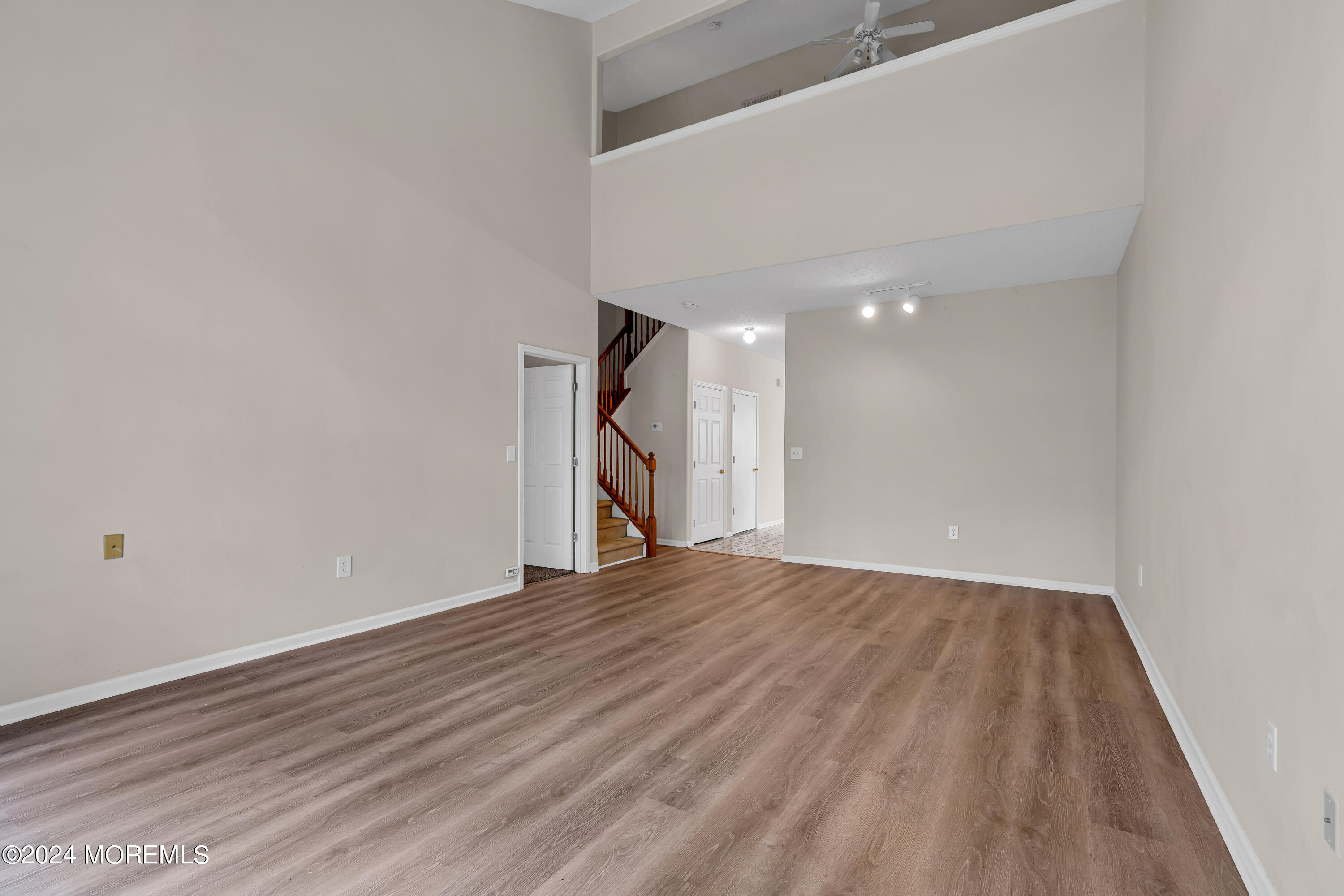 12 Riva Boulevard Brick, NJ 08723 - Photo 15 of 36 a view of an empty room with wooden floor