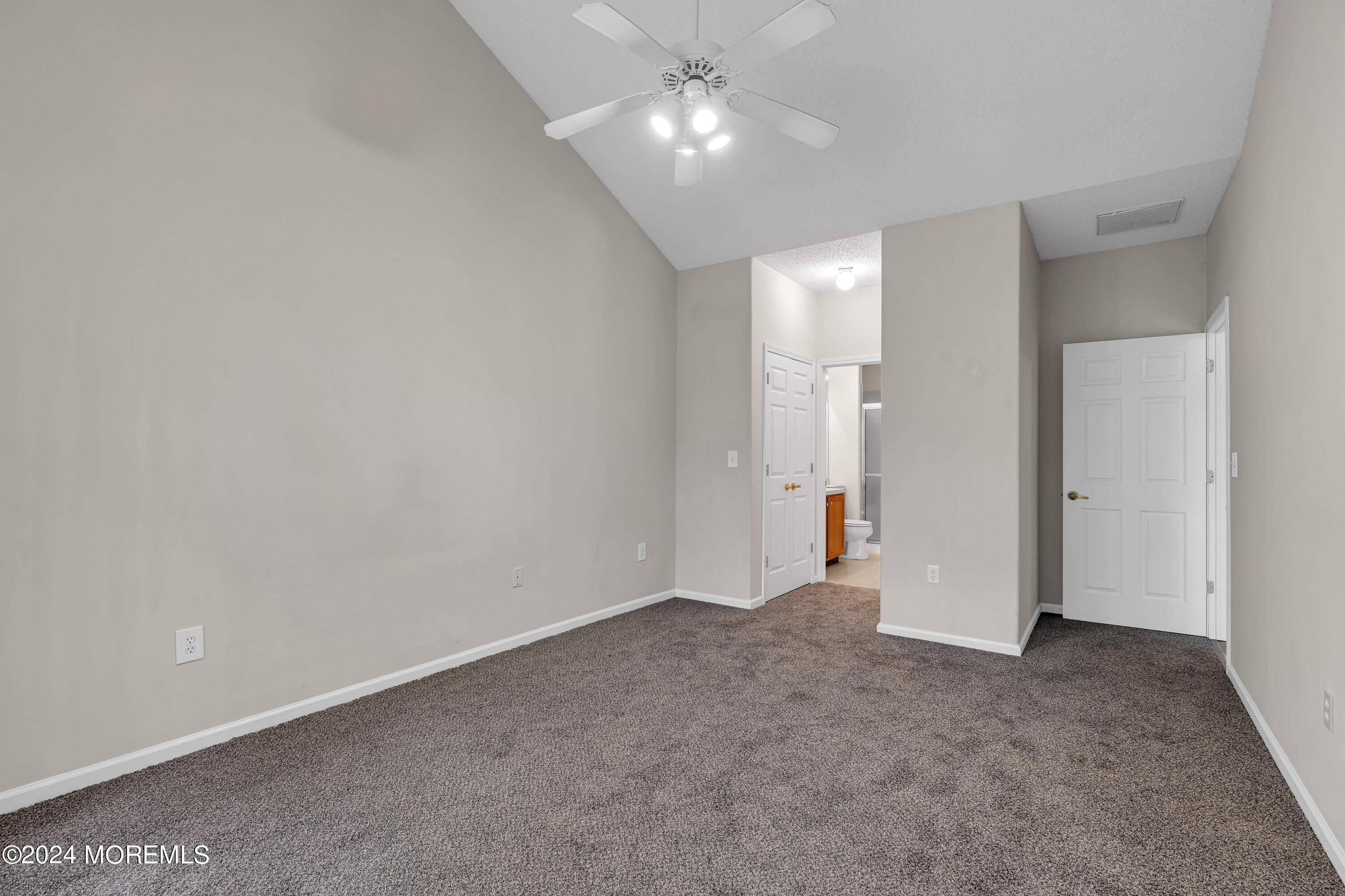 12 Riva Boulevard Brick, NJ 08723 - Photo 18 of 36 a view of an empty room with a ceiling fan and window