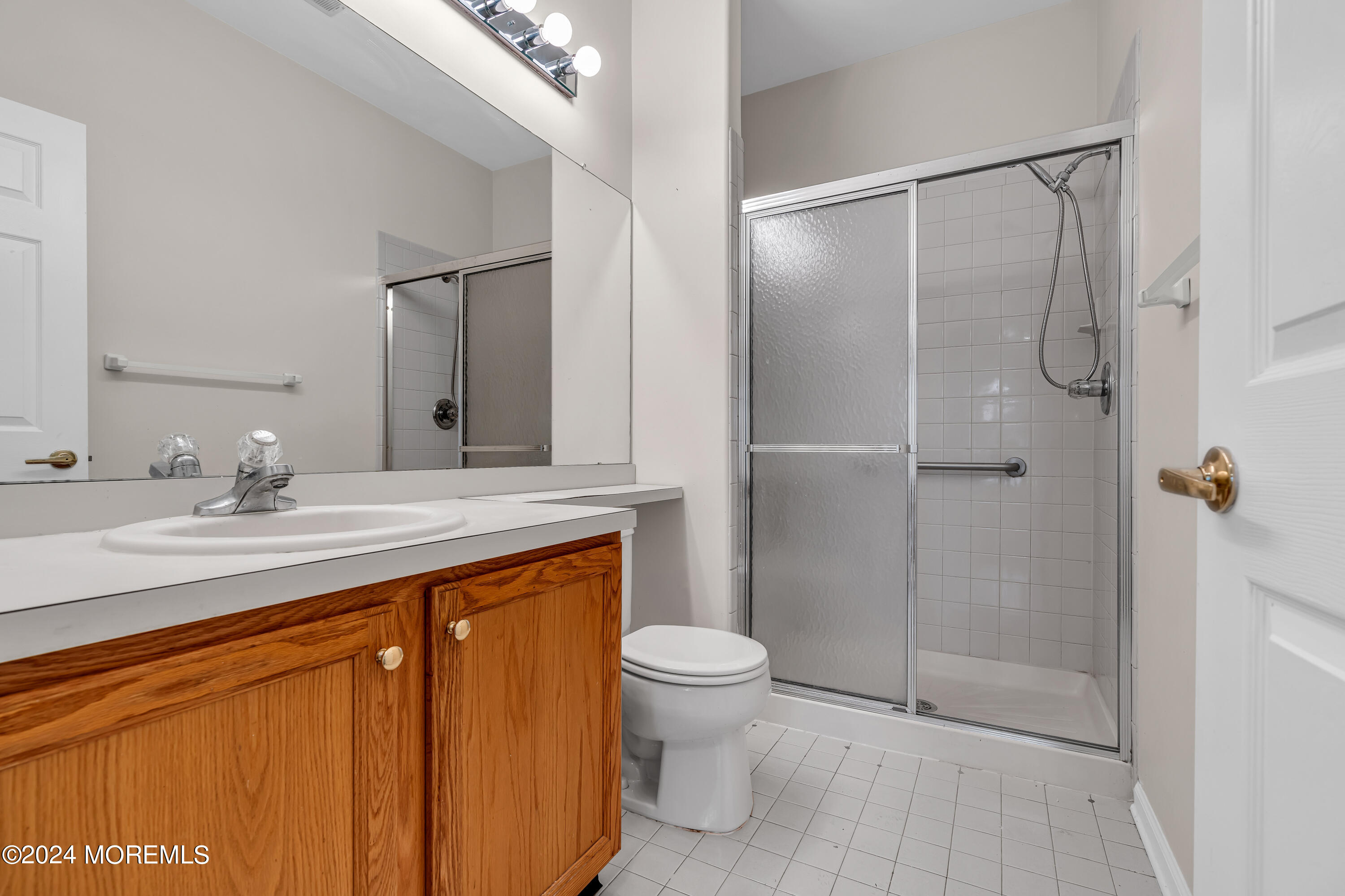 12 Riva Boulevard Brick, NJ 08723 - Photo 21 of 36 a bathroom with a granite countertop sink toilet and shower