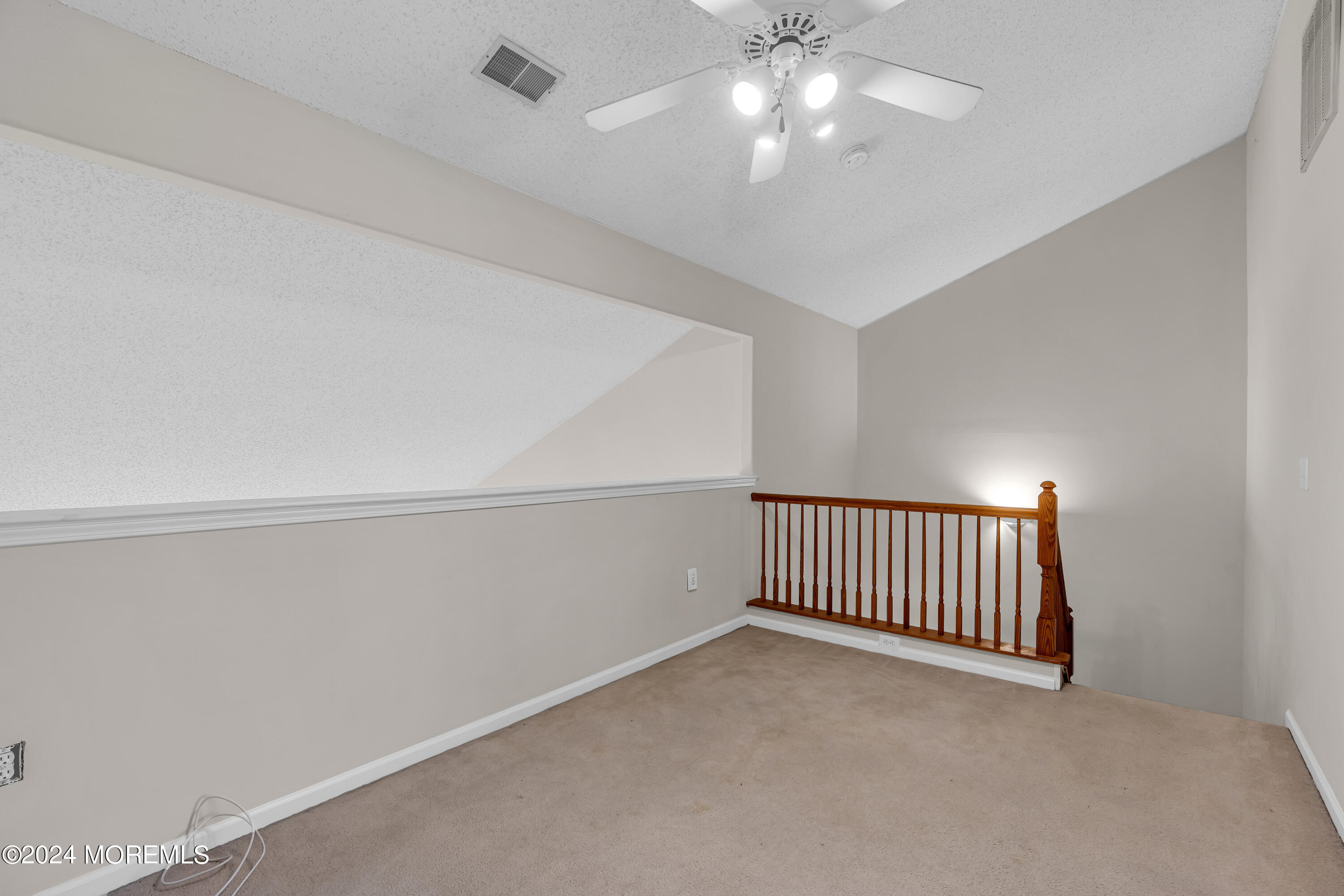 12 Riva Boulevard Brick, NJ 08723 - Photo 25 of 36 a view of an empty room with a chandelier fan