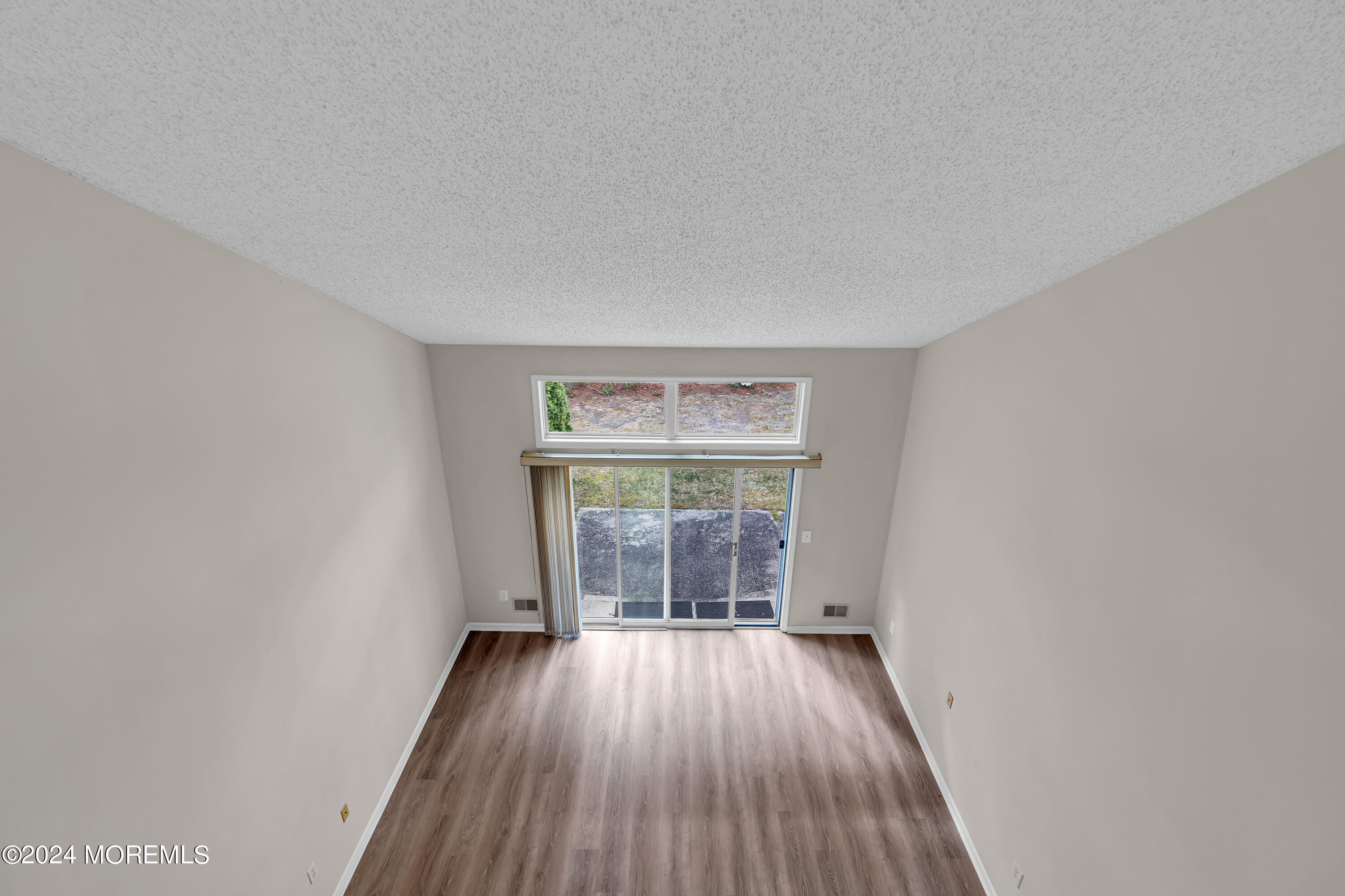 12 Riva Boulevard Brick, NJ 08723 - Photo 26 of 36 wooden floor in an empty room with a window