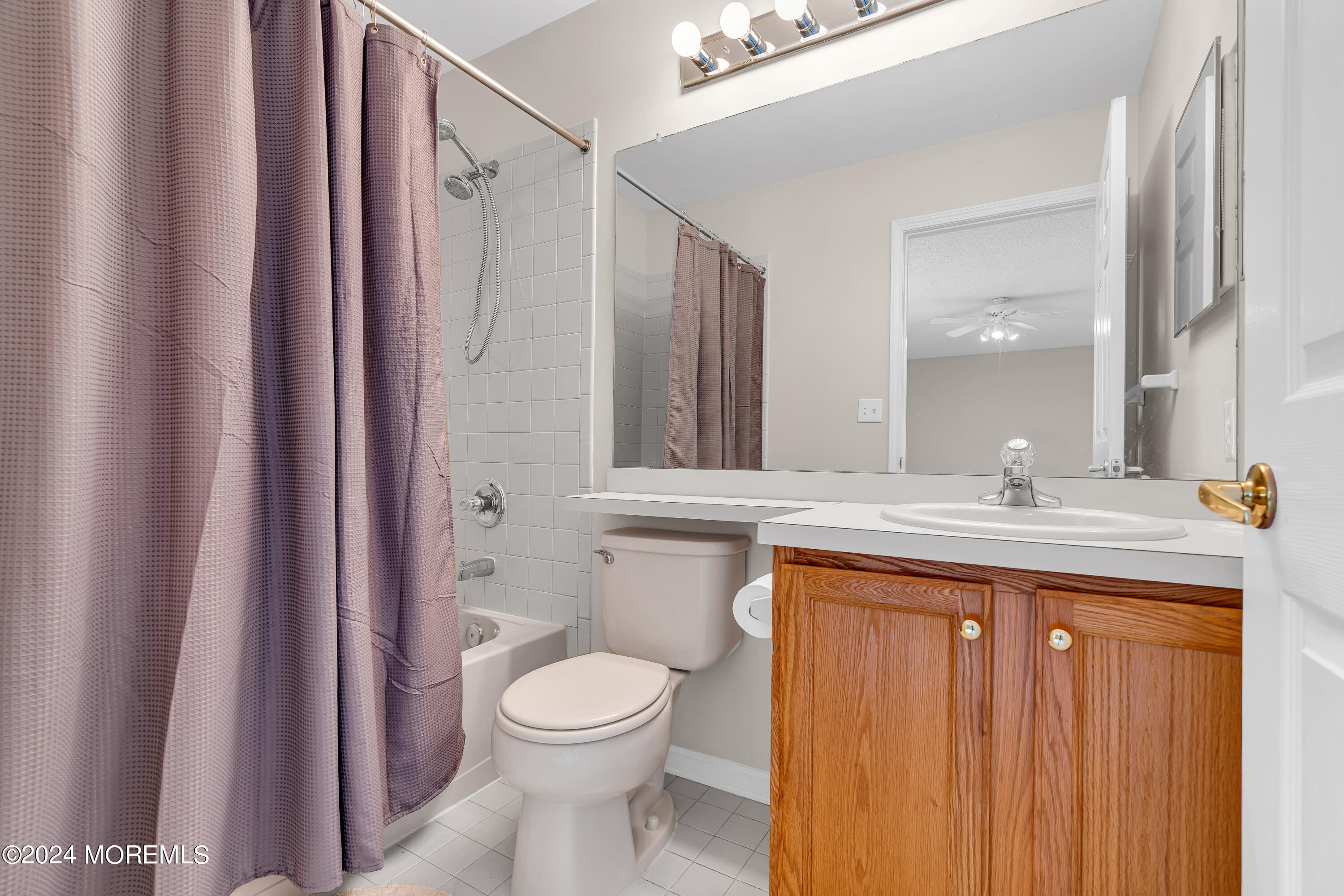 12 Riva Boulevard Brick, NJ 08723 - Photo 27 of 36 a bathroom with a granite countertop sink a toilet and a mirror