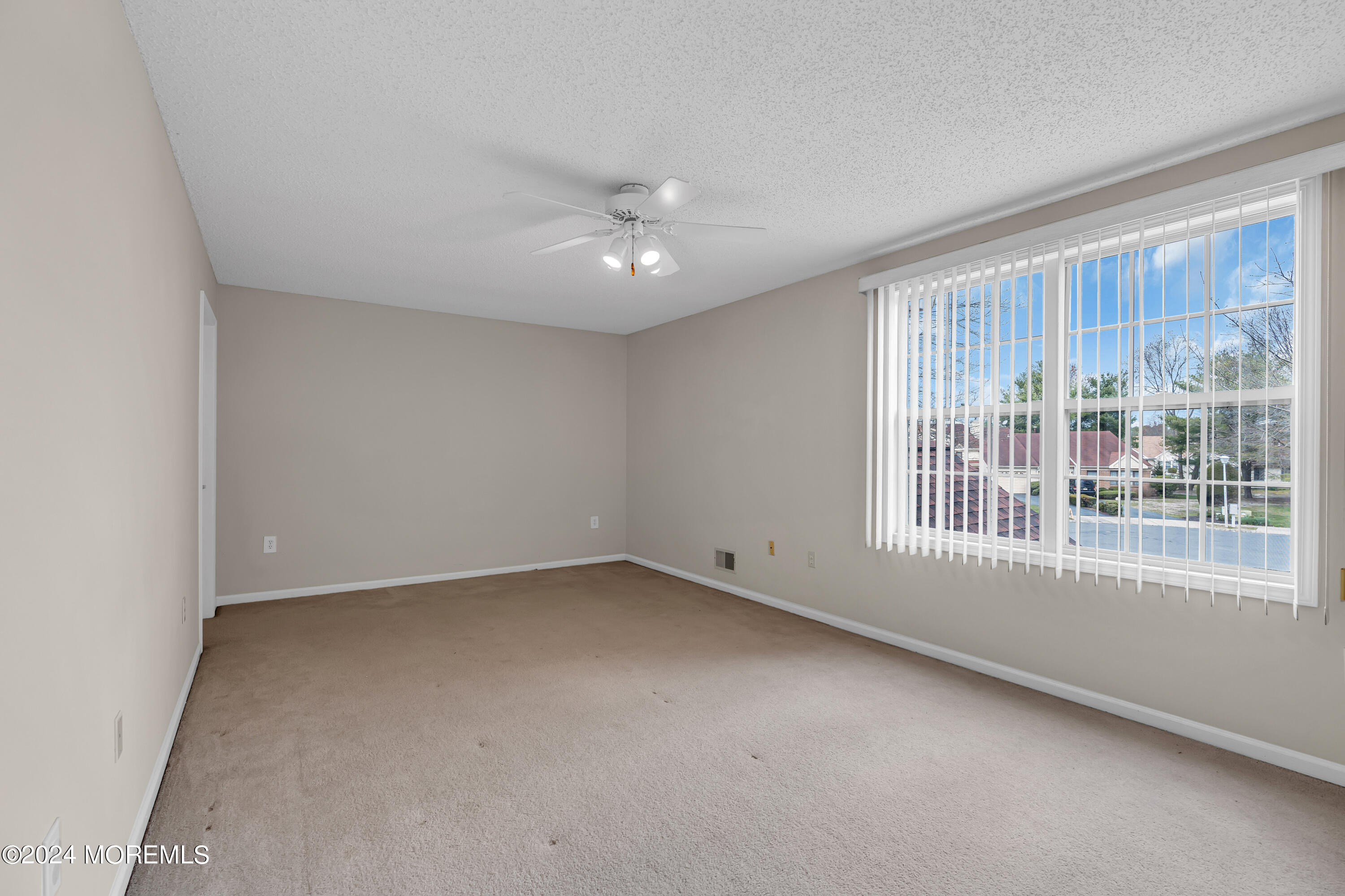 12 Riva Boulevard Brick, NJ 08723 - Photo 28 of 36 an empty room with a empty space and windows
