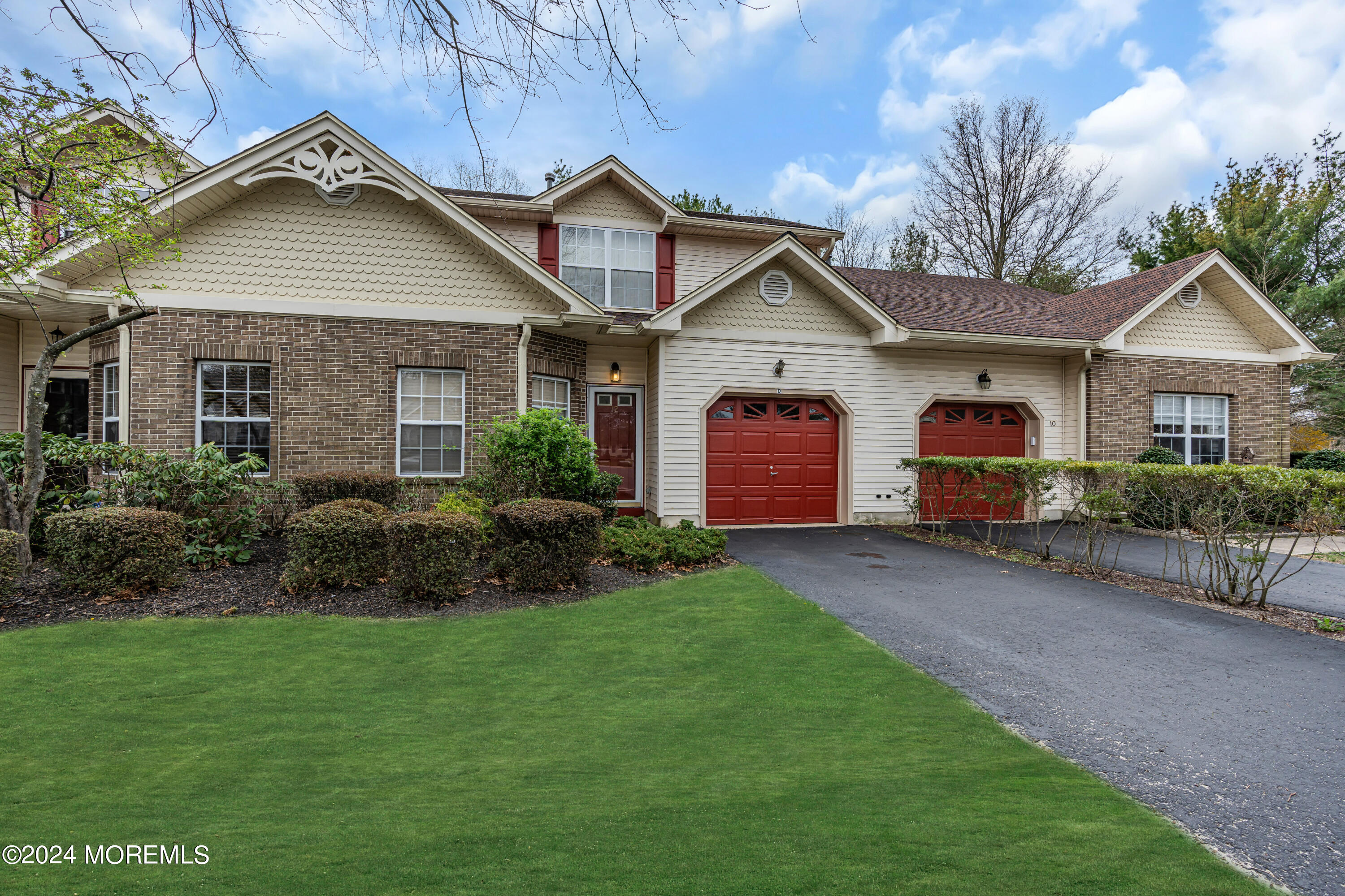 12 Riva Boulevard Brick, NJ 08723 - Photo 3 of 36 a front view of a house with a garden and plants