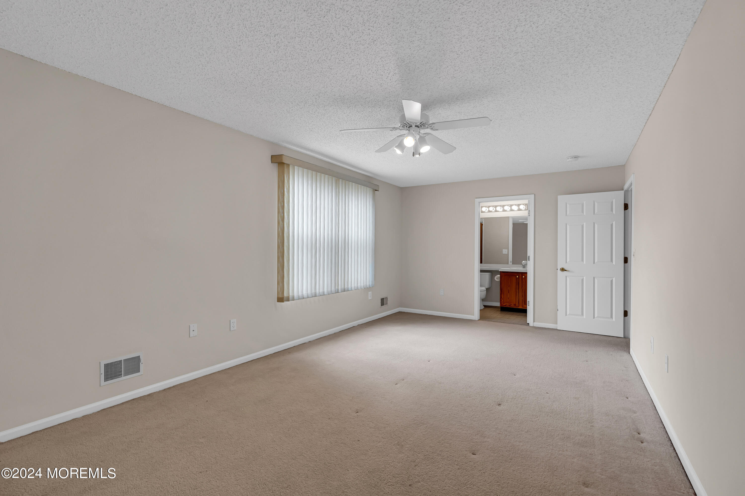 12 Riva Boulevard Brick, NJ 08723 - Photo 31 of 36 an empty room with windows and closet