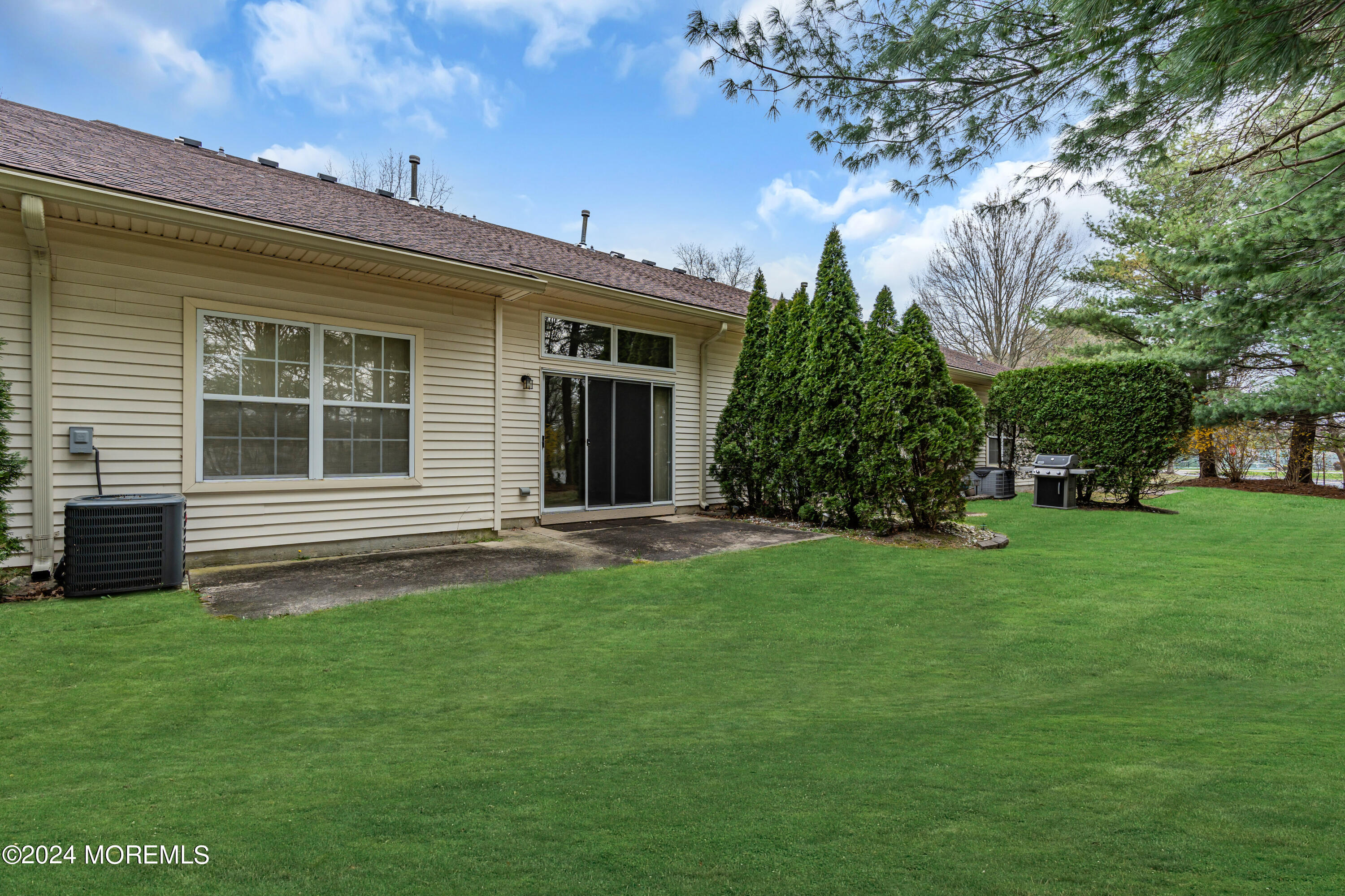 12 Riva Boulevard Brick, NJ 08723 - Photo 36 of 36 a house with a tree in front of it