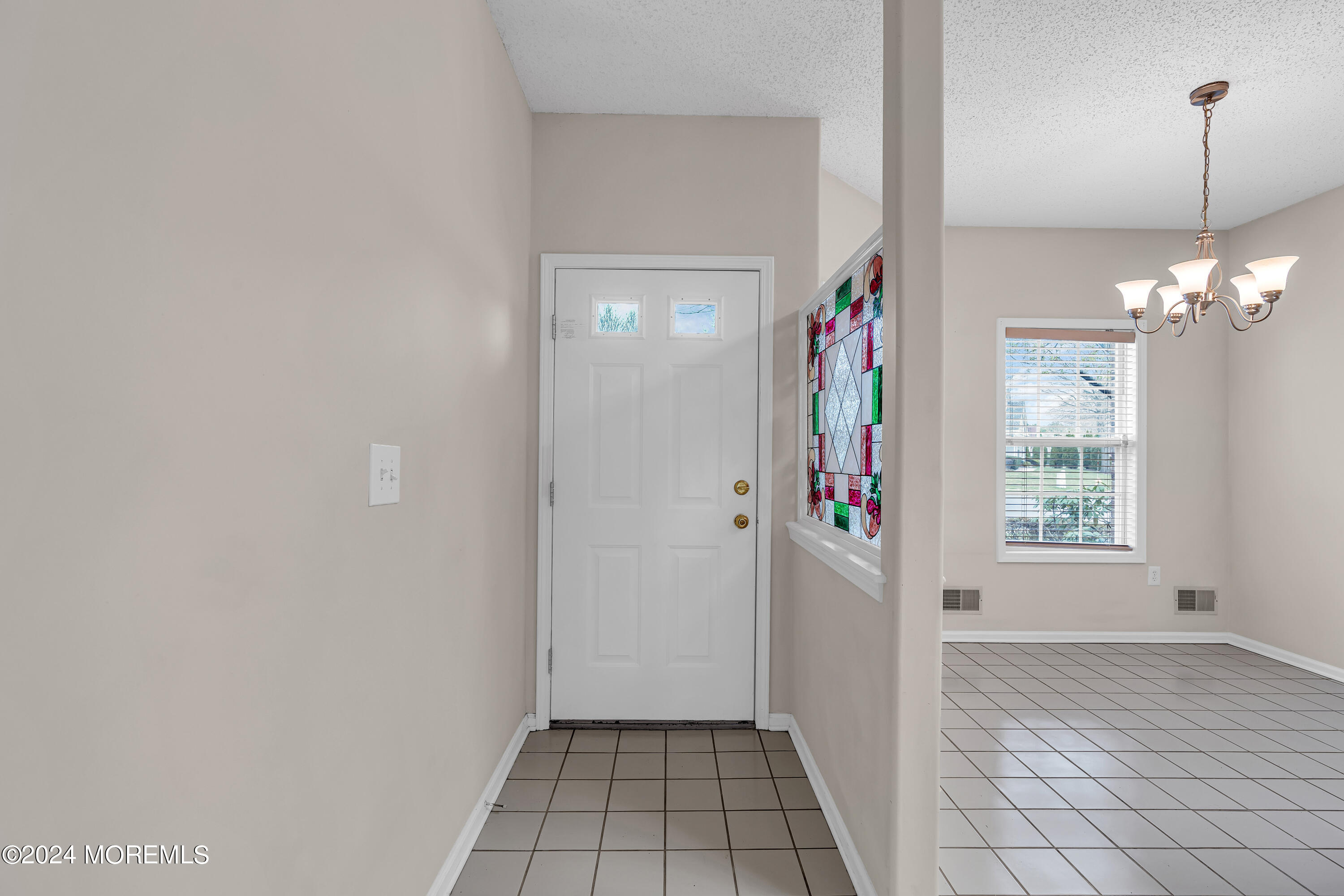 12 Riva Boulevard Brick, NJ 08723 - Photo 4 of 36 a view of an entryway with window and stairs