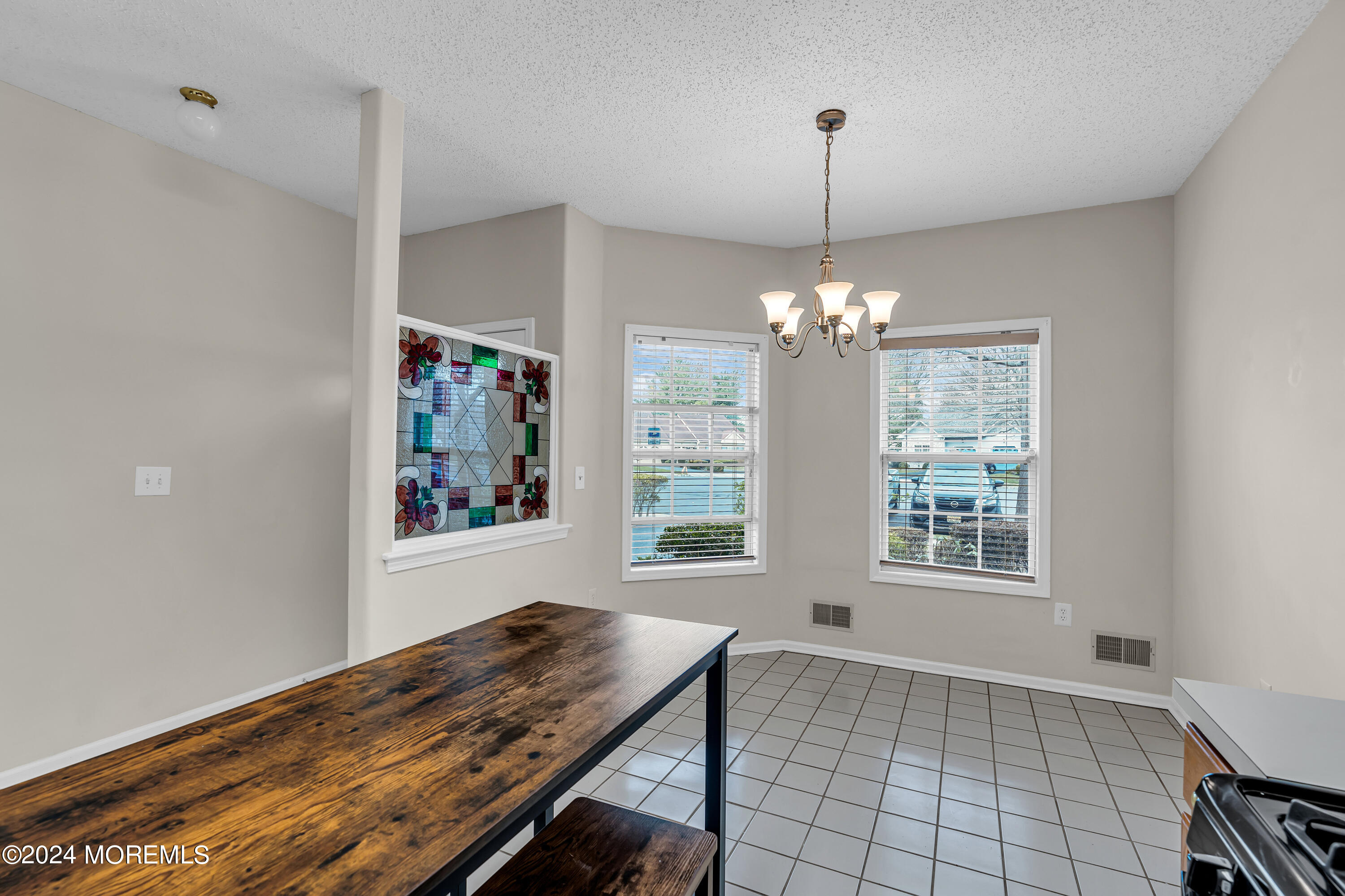 12 Riva Boulevard Brick, NJ 08723 - Photo 6 of 36 a view of a room with window and chandelier