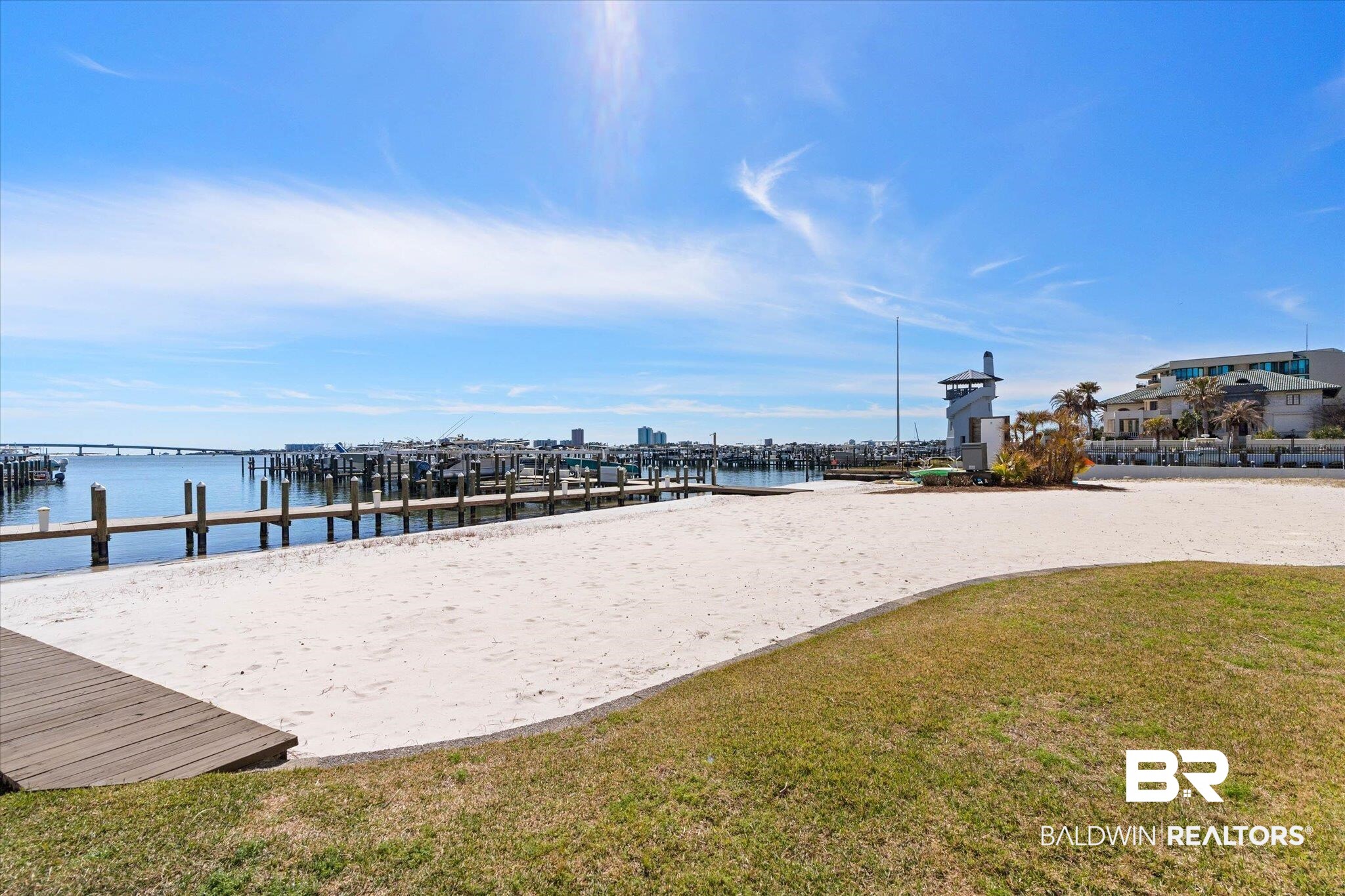 27770 Canal Road, Unit 2102 Orange Beach, AL 36561 - Photo 15 of 19 View of community featuring a water view, a lawn, and a boat dock