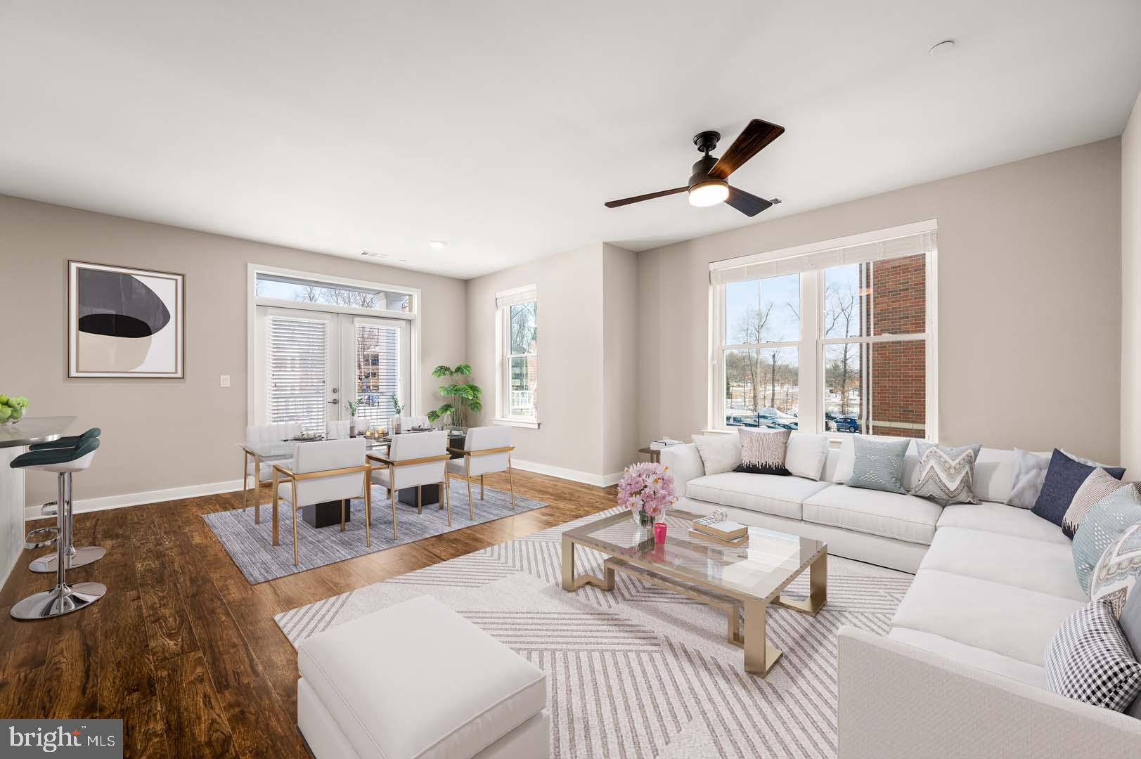 780 Constitution Drive, Unit 300 Exton, PA 19341 - Photo 3 of 5 a living room with furniture and a large window