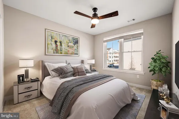 a bedroom with bed and a window