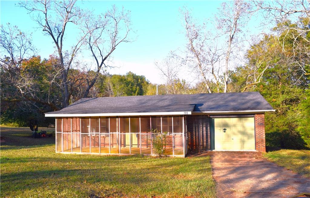 705 Triune Mill Road Thomaston, GA 30286 - Photo 1 of 34 a front view of a house with a yard table and chairs