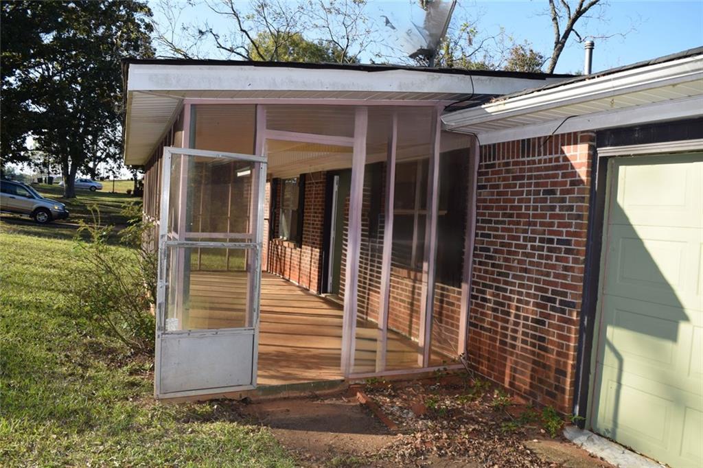 705 Triune Mill Road Thomaston, GA 30286 - Photo 15 of 34 a view of a house with a door
