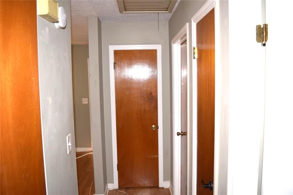 705 Triune Mill Road Thomaston, GA 30286 - Photo 19 of 34 a view of a bathroom from a hallway