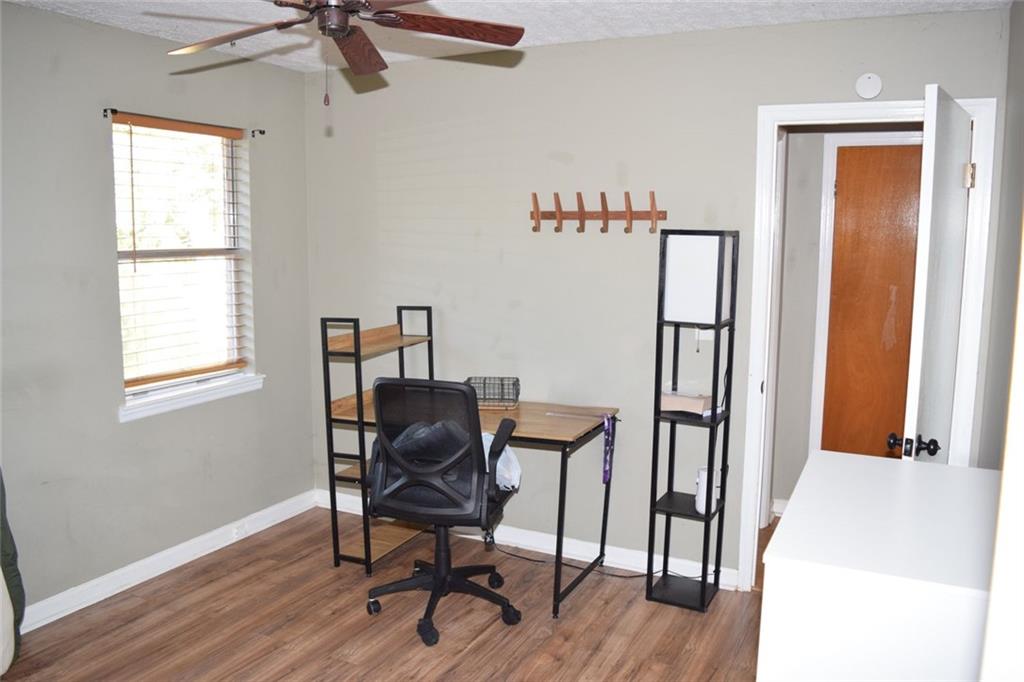 705 Triune Mill Road Thomaston, GA 30286 - Photo 20 of 34 a view of a workspace with furniture and a window