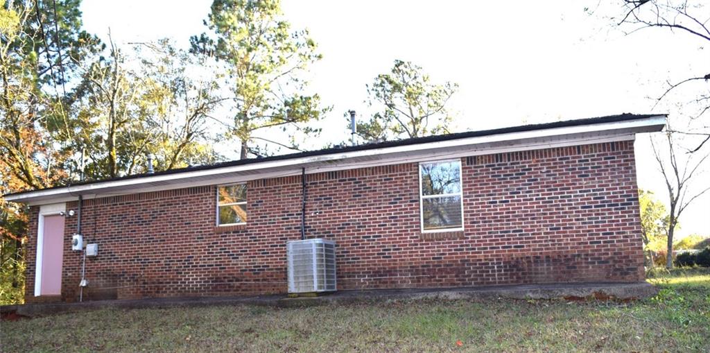 705 Triune Mill Road Thomaston, GA 30286 - Photo 27 of 34 a view of a brick house with large windows