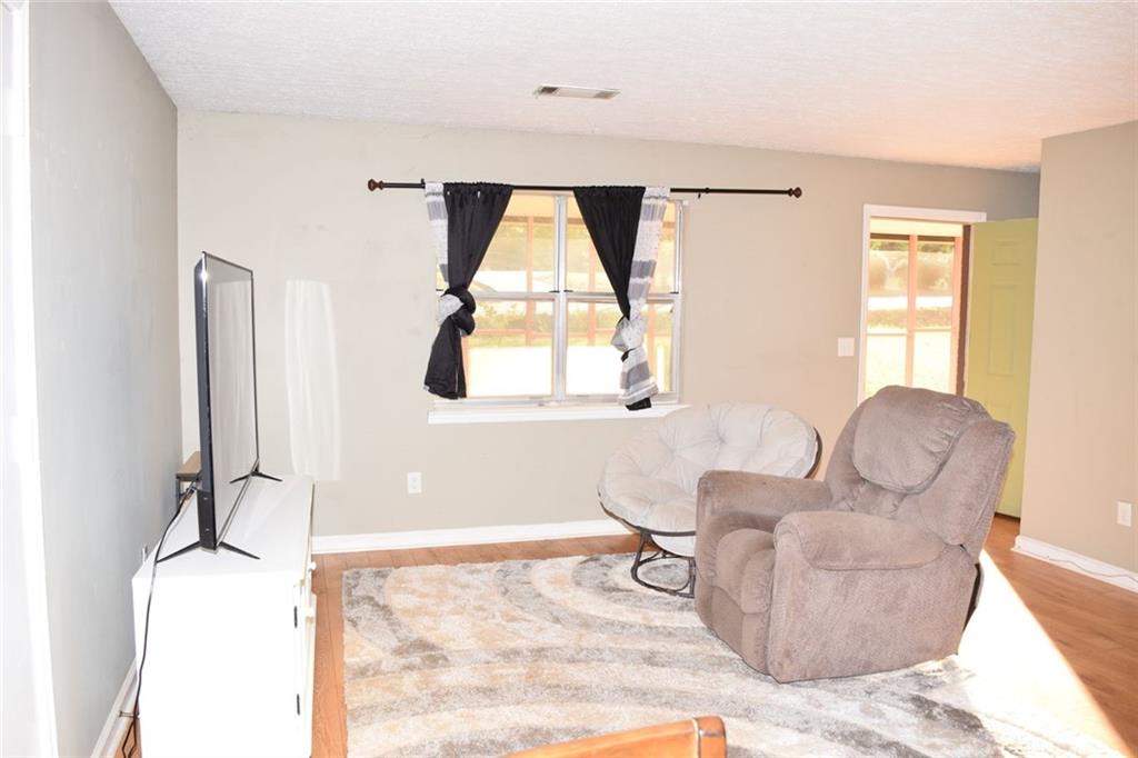 705 Triune Mill Road Thomaston, GA 30286 - Photo 5 of 34 a living room with furniture and a window