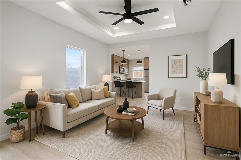 9206 North 56th Lane, Unit 4 Mission, TX 78573 - Photo 11 of 14 a living room with furniture and a flat screen tv
