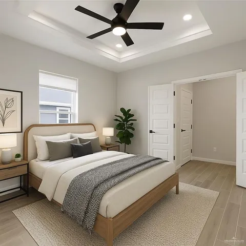 a bedroom with bed and a chandelier