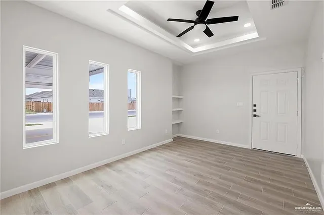 a view of an empty room with a window