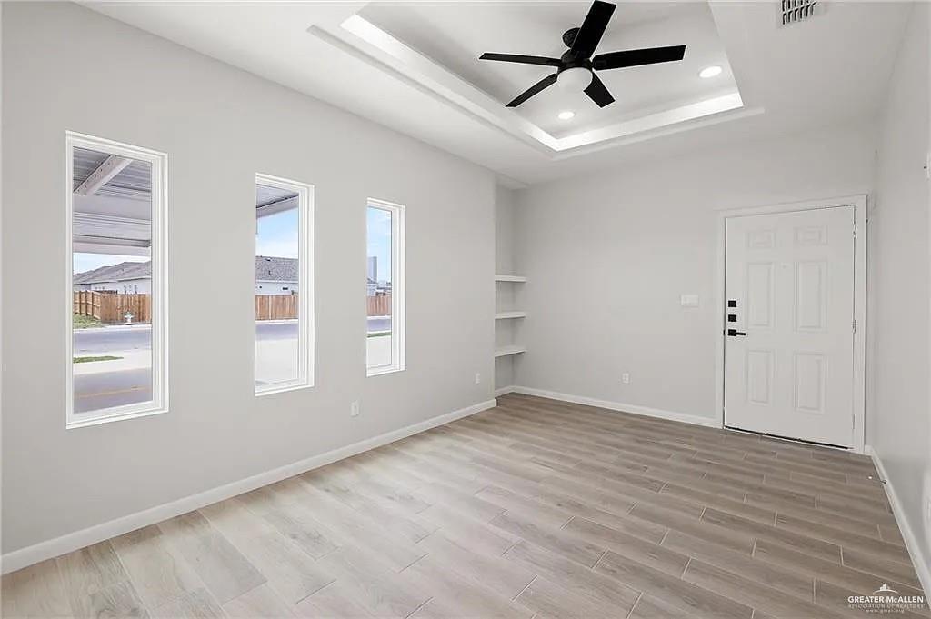 9206 North 56th Lane, Unit 4 Mission, TX 78573 - Photo 2 of 14 a view of an empty room with a window