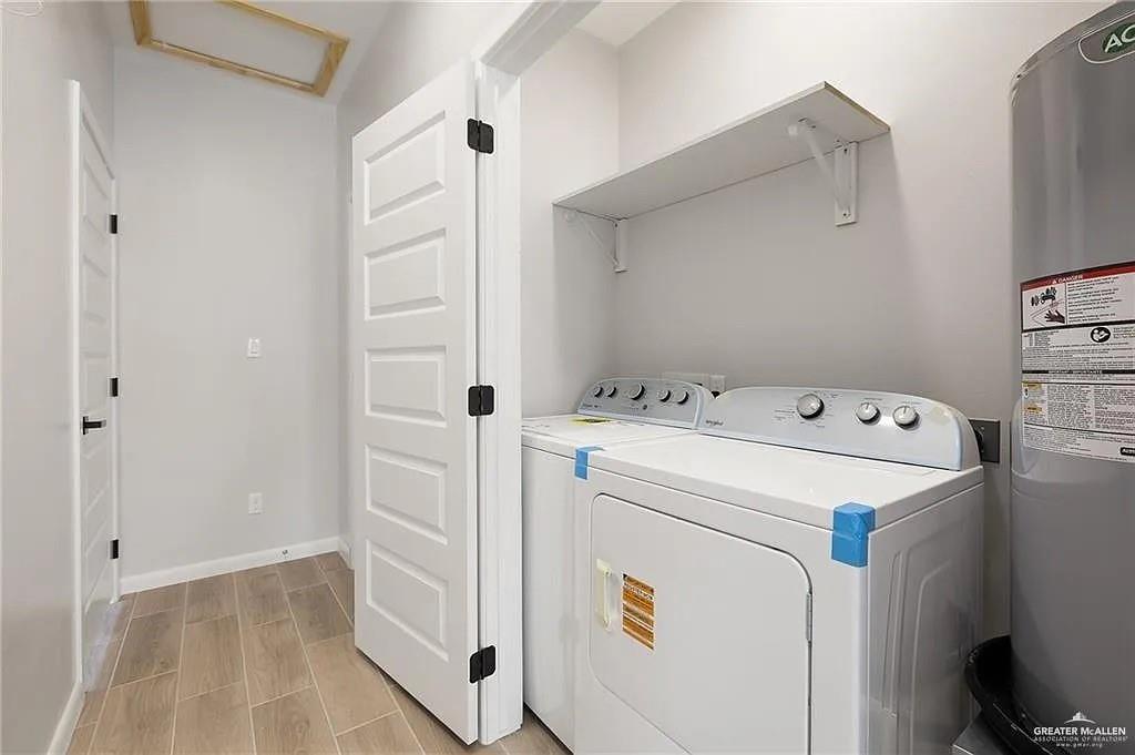 9206 North 56th Lane, Unit 4 Mission, TX 78573 - Photo 6 of 14 a utility room with dryer and washer