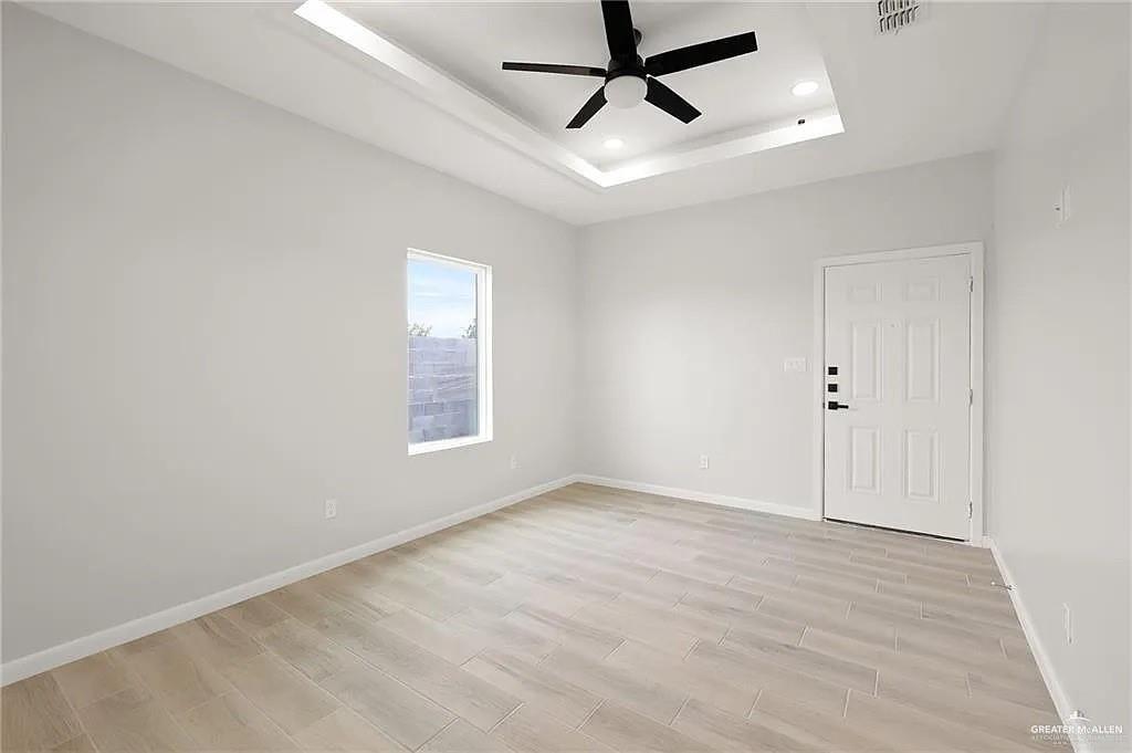9206 North 56th Lane, Unit 4 Mission, TX 78573 - Photo 9 of 14 wooden floor in an empty room