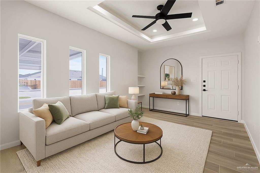 9206 North 56th Lane, Unit 4 Mission, TX 78573 - Photo 10 of 14 a living room with furniture and a wooden floor
