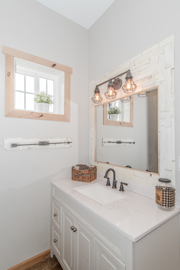 1255 West Dupont Road Morris, IL 60450 - Photo 17 of 26 a bathroom with a sink and a mirror