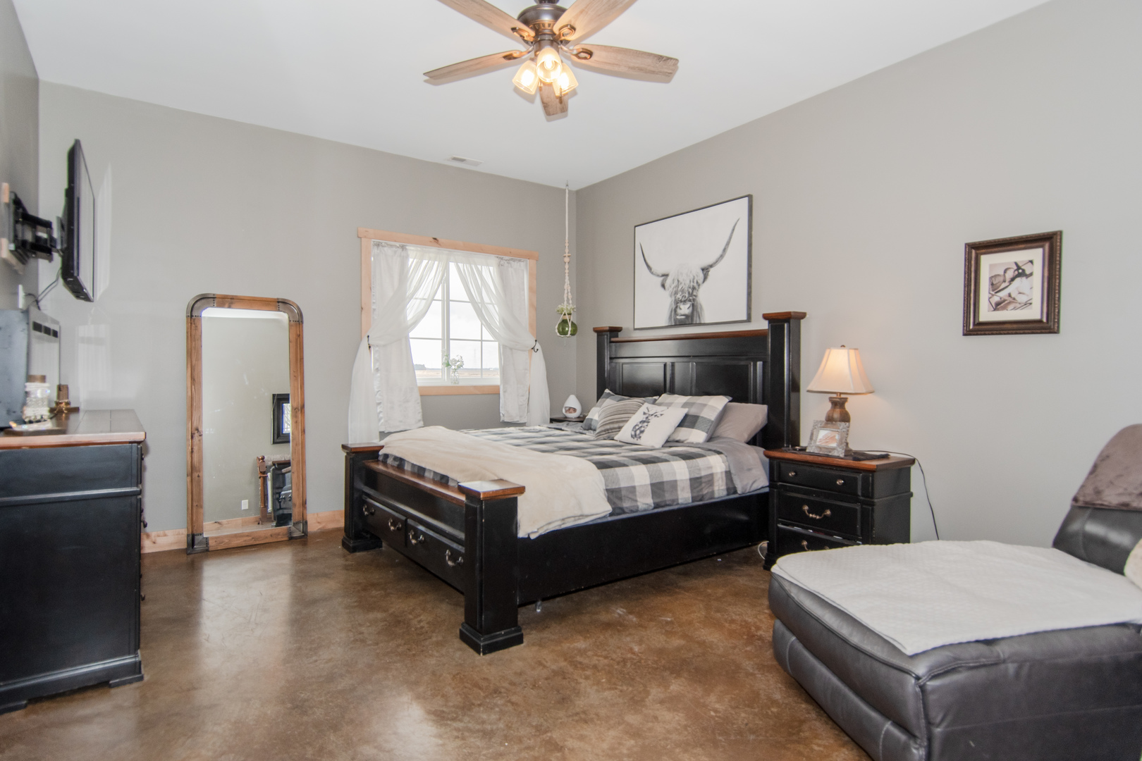 1255 West Dupont Road Morris, IL 60450 - Photo 18 of 26 a bedroom with a bed and a chandelier