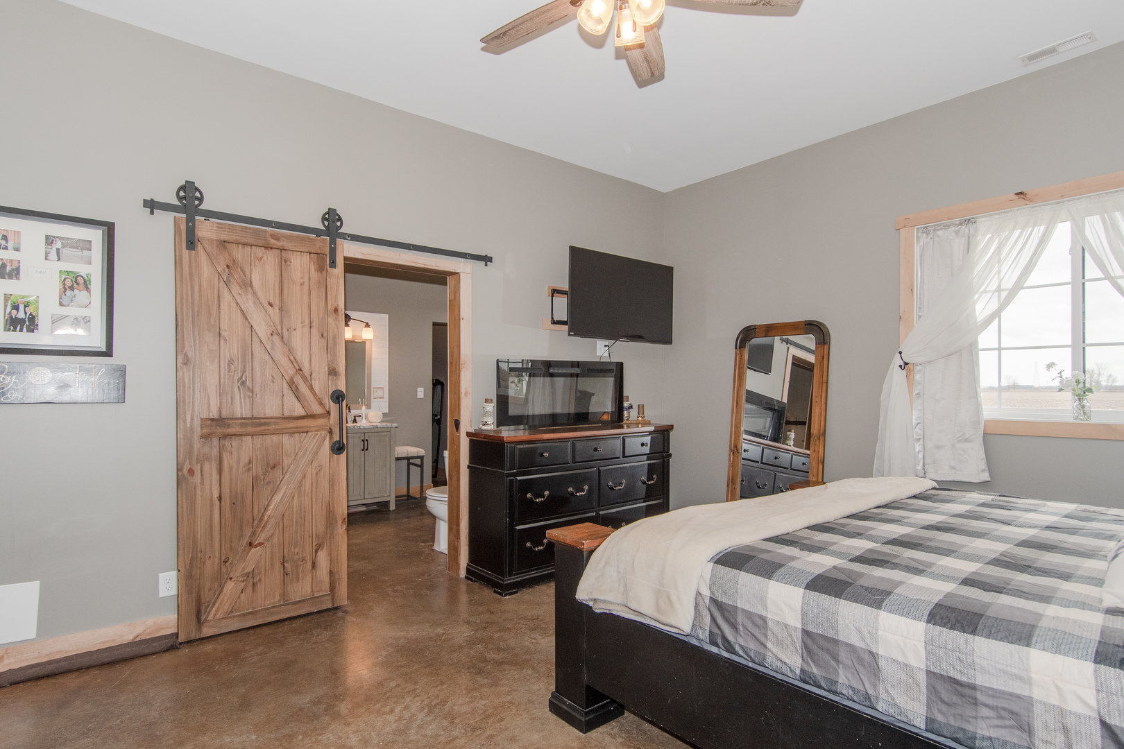 1255 West Dupont Road Morris, IL 60450 - Photo 19 of 26 a bedroom with a bed and a flat tv screen