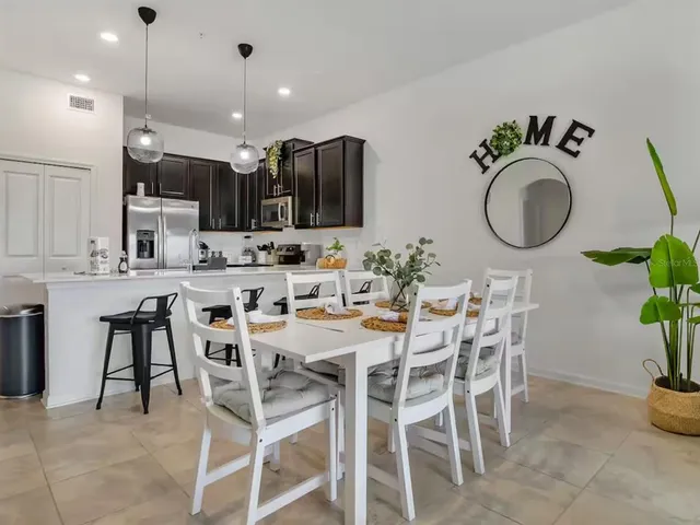 a kitchen with a sink and refrigerator