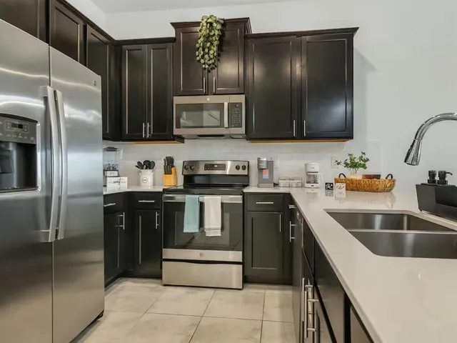 a kitchen with a stove and a microwave