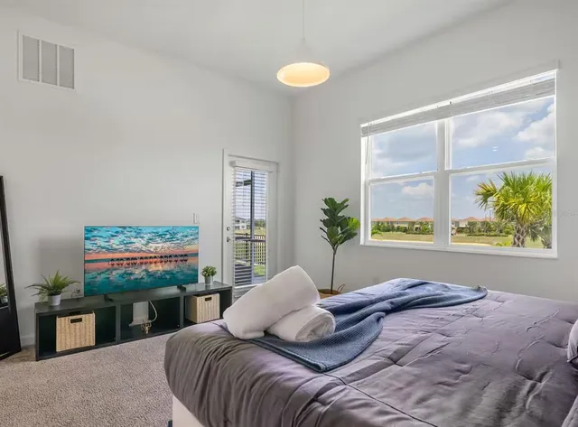 a bath tub sitting in a bathroom next to a sink