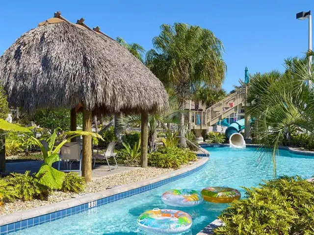 a view of a swimming pool and a yard