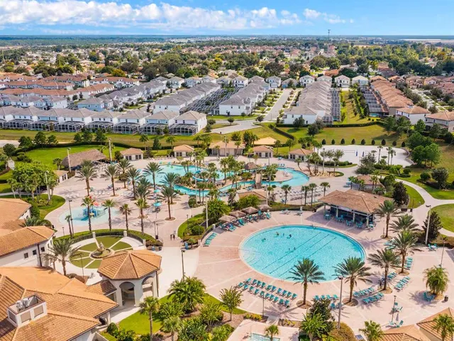 an aerial view of residential houses and lake view