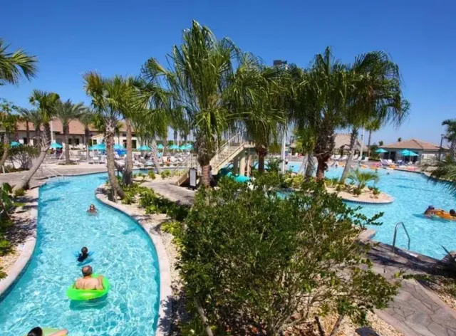 a living room with furniture a rug and white walls
