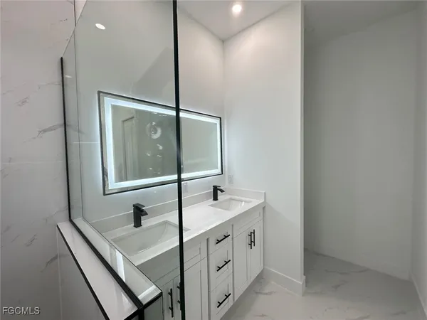 a bathroom with a sink and a mirror
